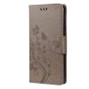 Peněženkové pouzdro Embossing Pattern Motyl a květ tmavěhnědé – Motorola Moto G30 / G10 | Levné Kryty | Levné Kryty | Levné Kryty
